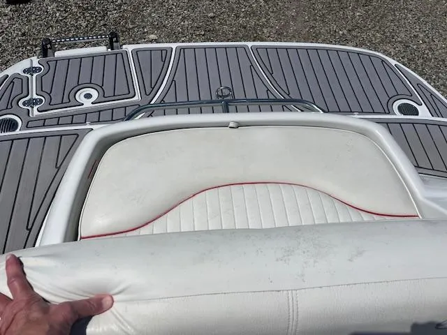 Slide: The Image of 2007 Crownline 240 EX boat with white seating and gray deck. - 9