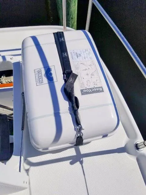 Slide: The Image of Life raft on 2006 Beneteau Swift Trawler 42 deck, secured with straps. - 21