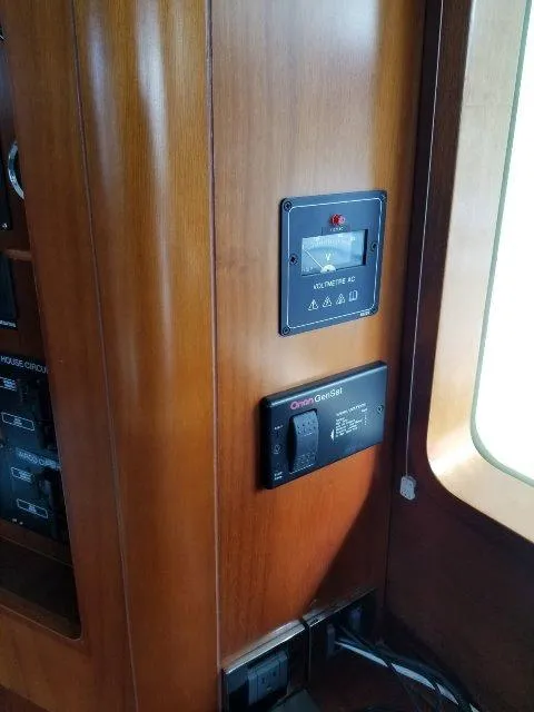 Slide: The Image of Control panel inside 2006 Beneteau Swift Trawler 42, featuring wooden interior. - 36