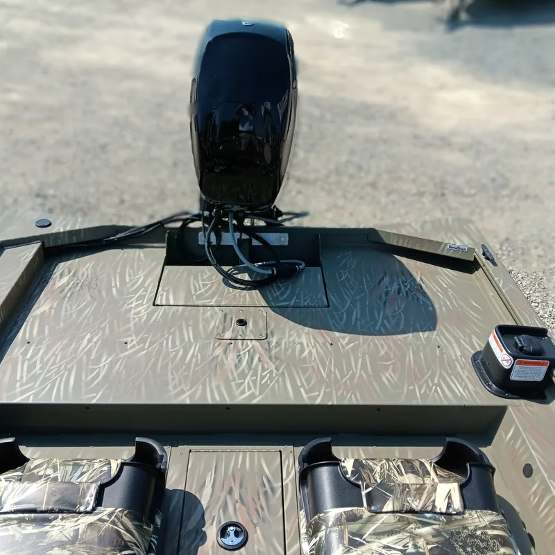 Slide: The Image of 2025 Tracker Grizzly 1754 SC boat with camo seats and motor, viewed from above. - 11