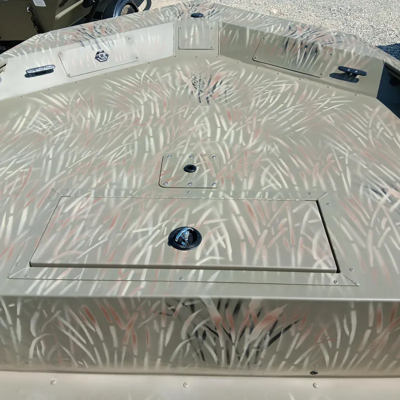 Slide: The Image of 2025 Tracker Grizzly 1754 SC boat deck with camouflage pattern design. - 4