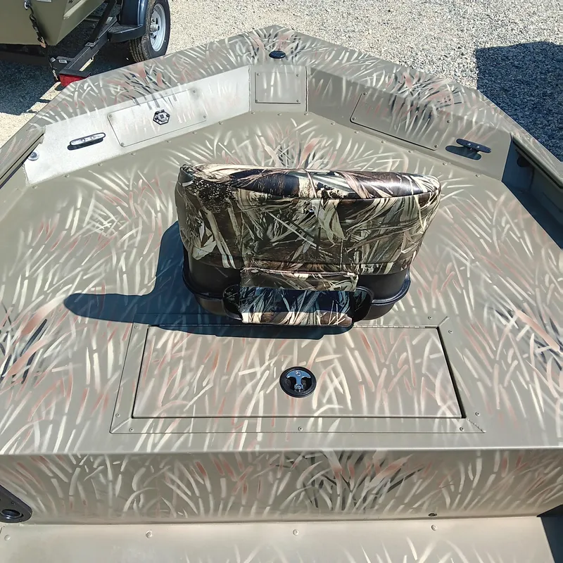 Slide: The Image of 2025 Tracker Grizzly 1754 SC boat with camouflage seating and deck design. - 6
