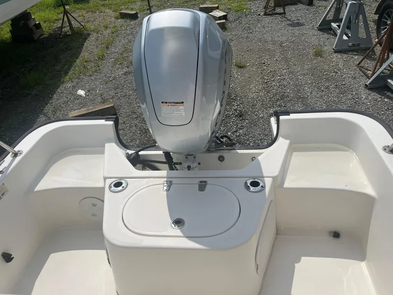 Slide: The Image of 2008 Boston Whaler 170 Montauk boat with outboard motor, viewed from the rear. - 12