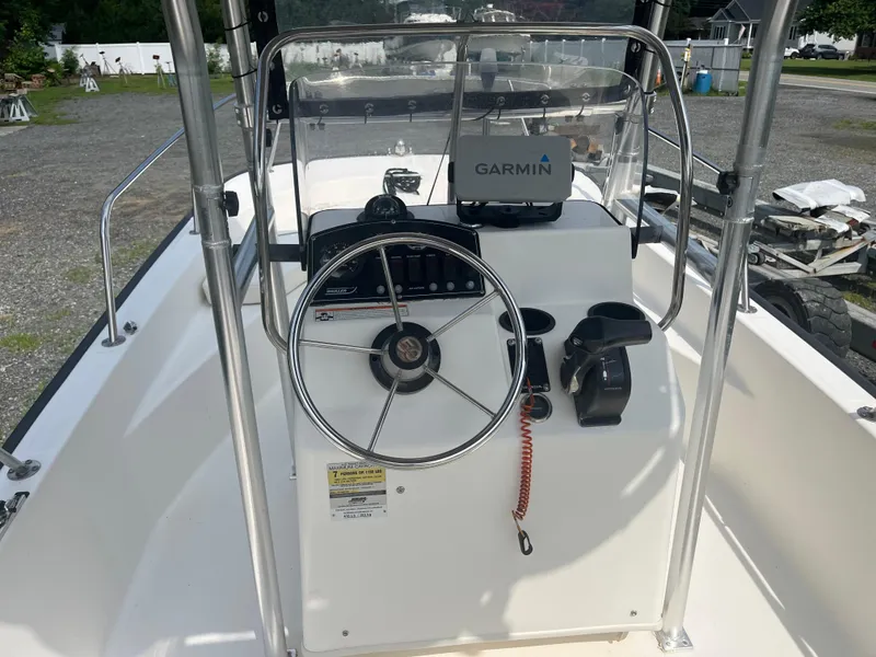 Slide: The Image of 2008 Boston Whaler 170 Montauk boat console with Garmin GPS and steering wheel. - 14