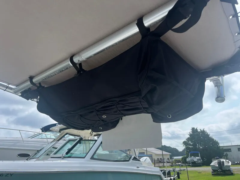 Slide: The Image of 2008 Boston Whaler 170 Montauk with overhead storage bag under canopy. - 16