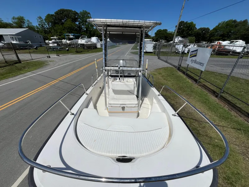 Slide: The Image of 2008 Boston Whaler 170 Montauk boat on display at a marina. - 17