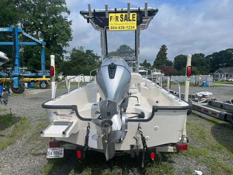 Slide: The Image of 2008 Boston Whaler 170 Montauk boat for sale, parked on gravel lot. - 23