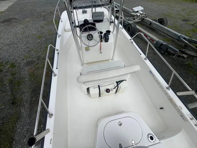 Slide: The Image of 2008 Boston Whaler 170 Montauk boat interior with steering console and seating. - 3