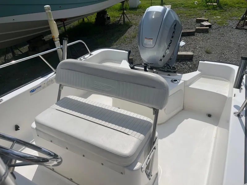 Slide: The Image of 2008 Boston Whaler 170 Montauk boat interior with Honda outboard motor. - 5