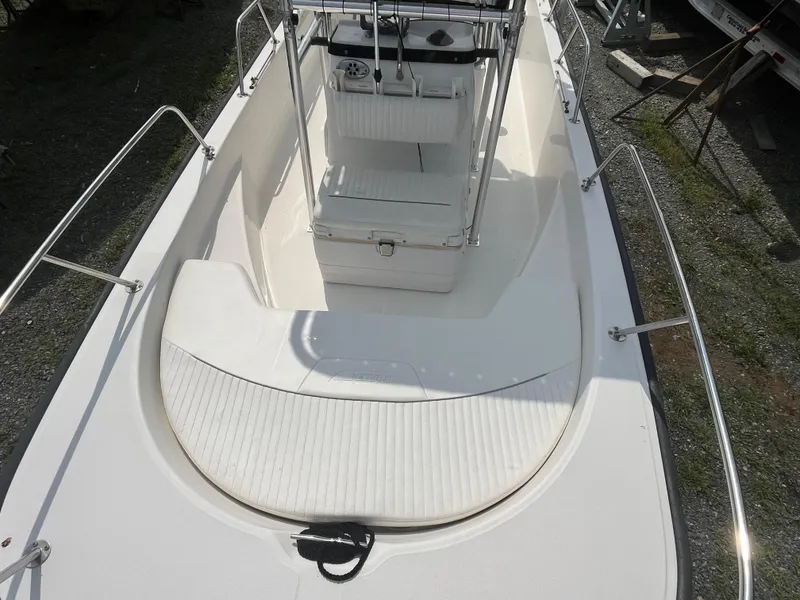 Slide: The Image of 2008 Boston Whaler 170 Montauk boat interior with seating and steering console. - 8
