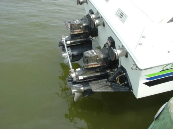 Slide: The Image of 1998 Corsa offshore flat deck boat with dual outboard motors in water. - 5