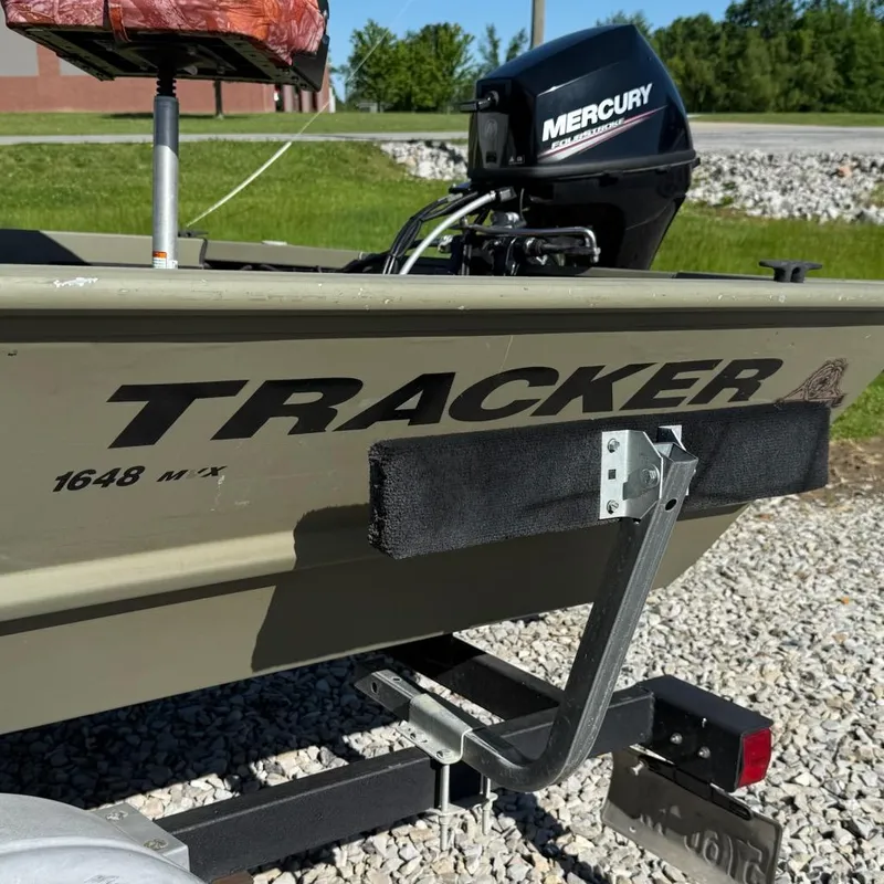 Slide: The Image of 2019 Tracker Grizzly Tracker 1648 MVX boat with Mercury motor on trailer. - 3