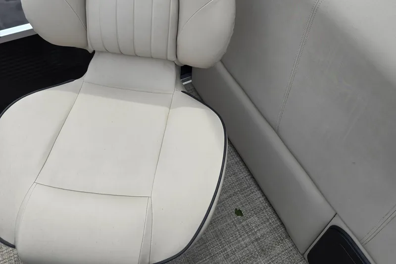Slide: The Image of 2019 Qwest LS 818 RLS boat interior with beige seating and carpeted flooring. - 10