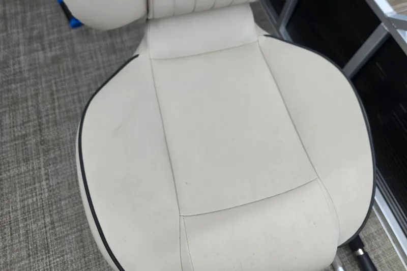 Slide: The Image of White seat of 2019 Qwest LS 818 RLS boat, featuring sleek design and black trim. - 11