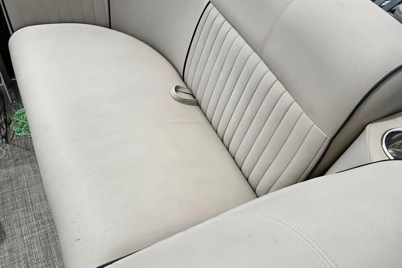 Slide: The Image of 2019 Qwest LS 818 RLS boat interior with beige seating and cup holder. - 3