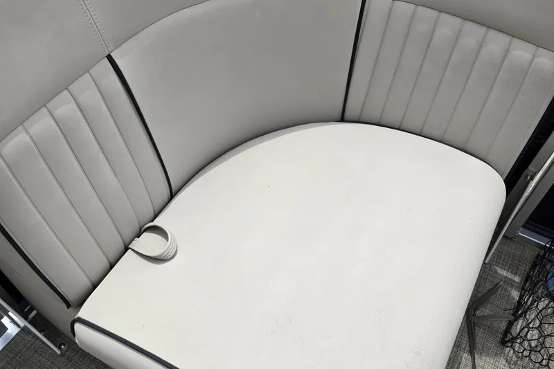 Slide: The Image of 2019 Qwest LS 818 RLS boat interior with white cushioned seating. - 5