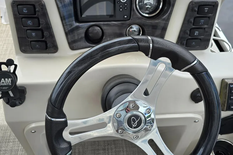 Slide: The Image of Steering wheel and dashboard of 2019 Qwest LS 818 RLS boat. - 6