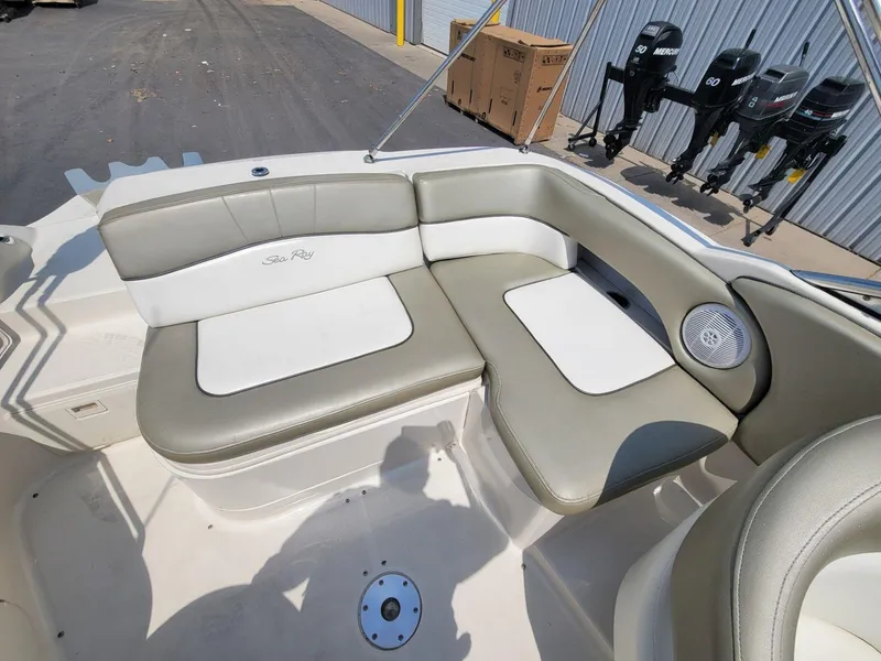 Slide: The Image of 2006 Sea Ray 220 Sundeck boat interior with beige seating and speaker. - 15