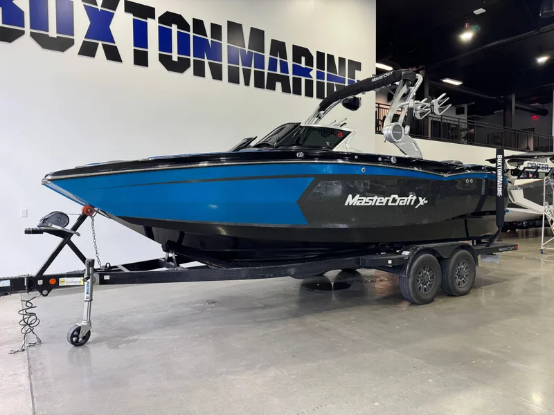Slide: The Image of 2018 MasterCraft XStar boat on trailer at Buxton Marine showroom. - 3