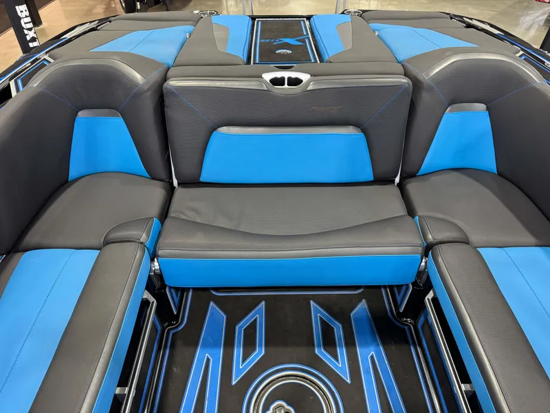 Slide: The Image of 2018 MasterCraft XStar interior with blue and black seating, showcasing modern design and comfort. - 30