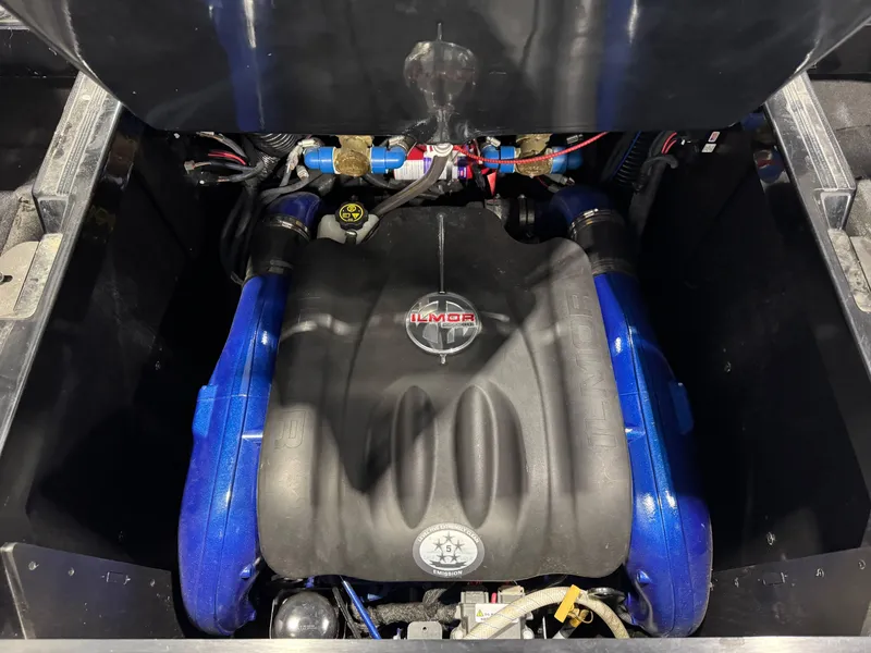Slide: The Image of 2018 MasterCraft XStar engine compartment with Ilmor engine, featuring blue accents. - 31