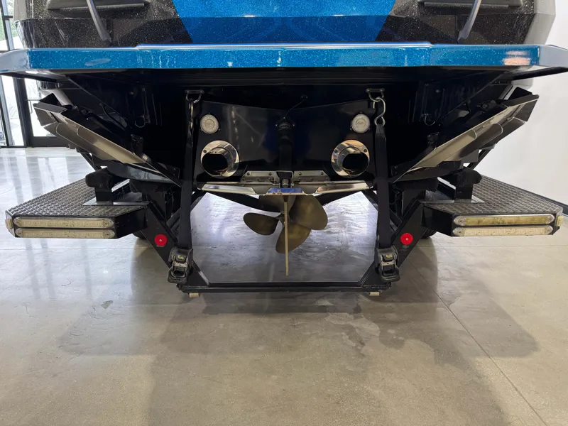 Slide: The Image of 2018 MasterCraft XStar boat stern with propeller and swim platform. - 7