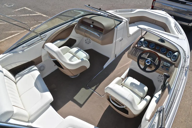 Slide: The Image of 2007 Cobalt 200 boat interior with white seating and modern dashboard. - 19