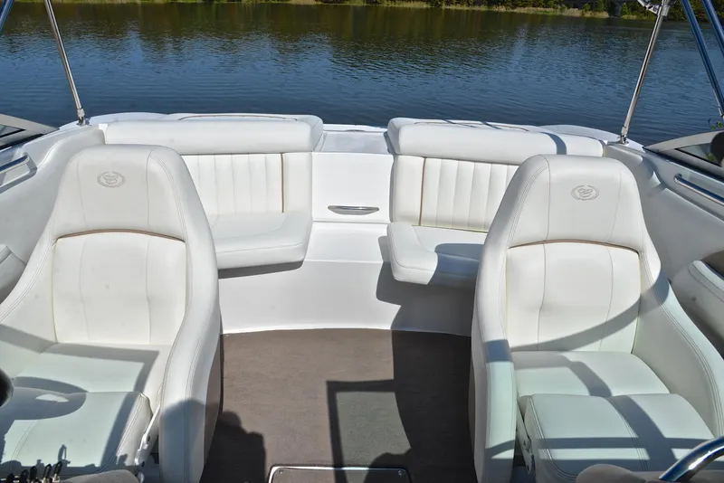 Slide: The Image of 2007 Cobalt 200 boat interior with white seating, on calm water. - 22