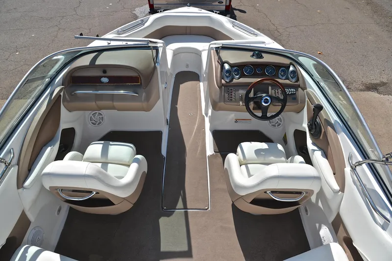 Slide: The Image of 2007 Cobalt 200 boat interior with dual seating and dashboard controls. - 23