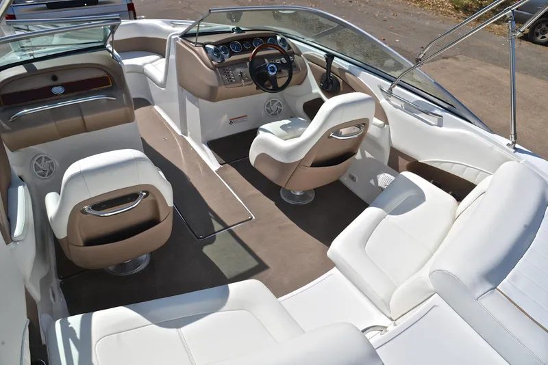 Slide: The Image of Luxurious interior of a 2007 Cobalt 200 boat with white and beige seating. - 24