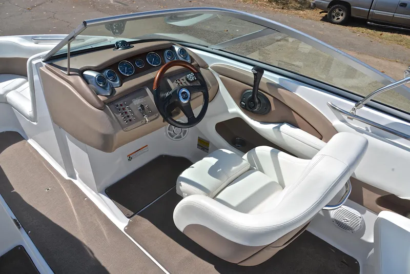 Slide: The Image of 2007 Cobalt 200 boat interior with steering wheel and dashboard controls. - 25