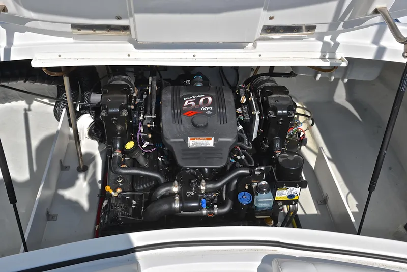 Slide: The Image of Engine compartment of a 2007 Cobalt 200 boat, featuring a 5.0 MPI engine. - 27