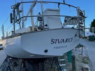 Slide: The Image of 1981 Cape Dory 33 Sloop sailboat on stands, named "SIVARO," located in Miami, FL. - 11