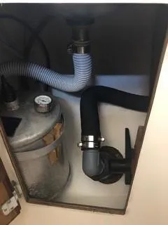 Slide: The Image of 1981 Cape Dory 33 Sloop plumbing system with hoses and tank. - 24