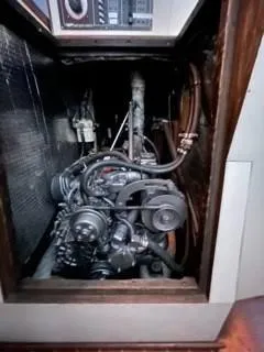 Slide: The Image of 1981 Cape Dory 33 Sloop engine compartment, showcasing mechanical components and wiring. - 27