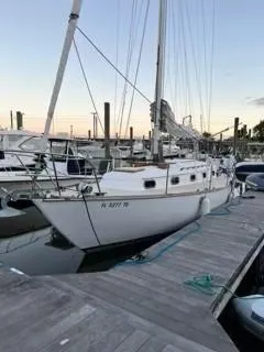 Slide: The Image of 1981 Cape Dory 33 Sloop docked at marina during sunset. - 5