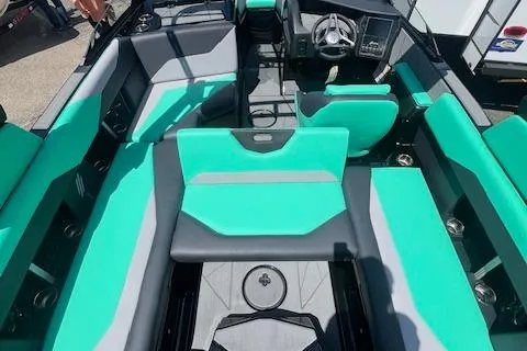 Slide: The Image of 2024 ATX Surf Boats 22 Type-S interior with teal and gray seating, modern dashboard. - 8