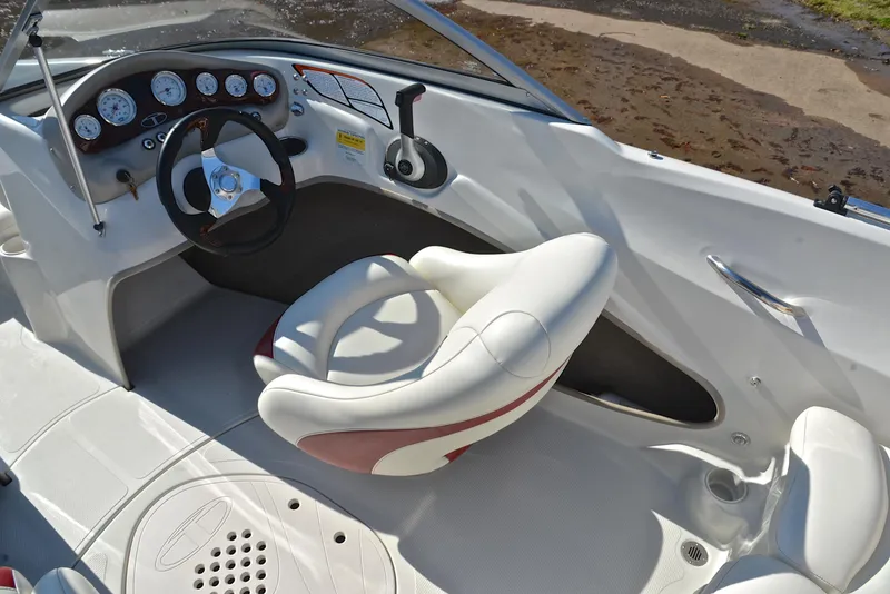 Slide: The Image of Interior of a 2014 Tahoe Q5 boat featuring steering wheel and dashboard controls. - 24