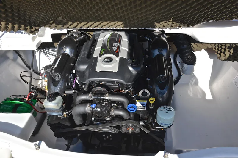 Slide: The Image of Engine compartment of a 2014 Tahoe Q5 boat, showcasing a 4.3L engine. - 27