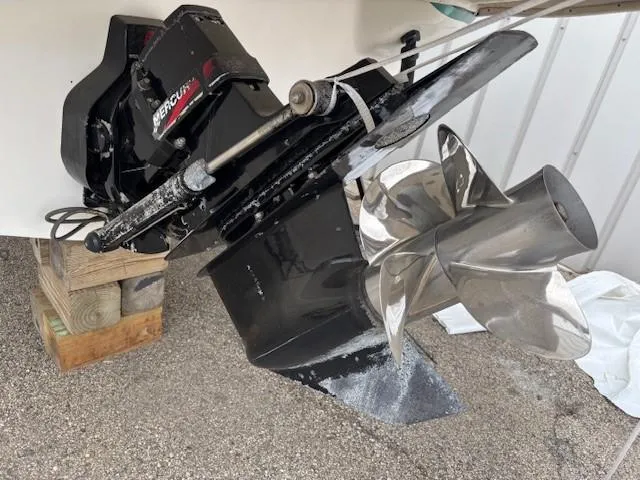 Slide: The Image of 2000 Sea Ray 280 SS boat propeller and engine detail, featuring a Mercury outdrive. - 4