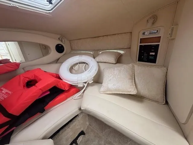 Slide: The Image of Interior of 2000 Sea Ray 280 SS boat with life jackets and cushions. - 9