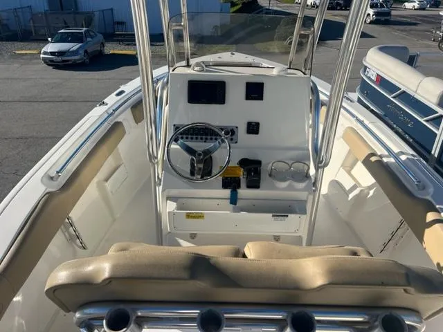 Slide: The Image of 2020 Key West 239 FS boat interior with steering console and seating. - 12