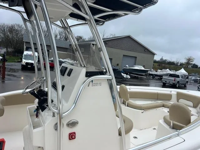 Slide: The Image of 2020 Key West 239 FS boat with seating, parked in a marina. - 15