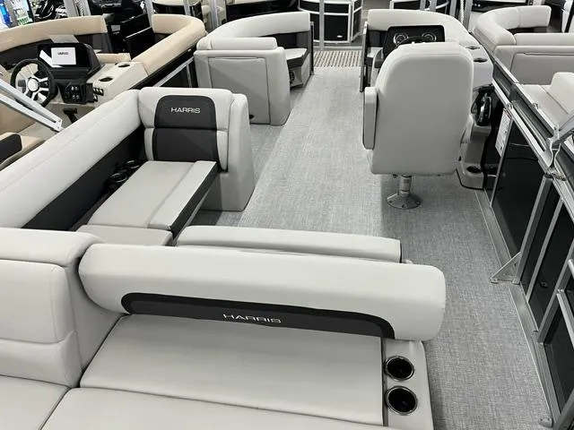 Slide: The Image of 2024 Harris Cruiser 210 pontoon boat interior with luxurious seating and modern design. - 10