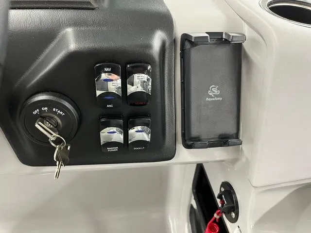 Slide: The Image of 2024 Harris Cruiser 210 dashboard with ignition, switches, and Aquatemp panel. - 11