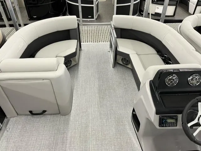 Slide: The Image of 2024 Harris Cruiser 210 interior with plush seating and modern dashboard. - 8