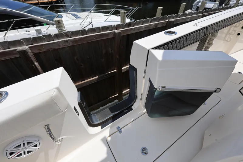 Slide: The Image of 2017 Wellcraft Scarab 302 Fisherman boat interior with open side door. - 12