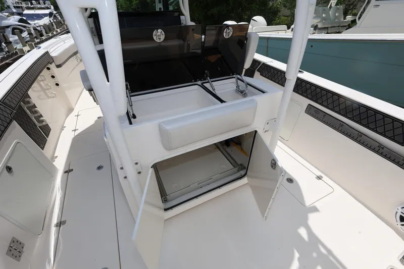 Slide: The Image of 2017 Wellcraft Scarab 302 Fisherman boat interior with storage compartment and seating. - 13