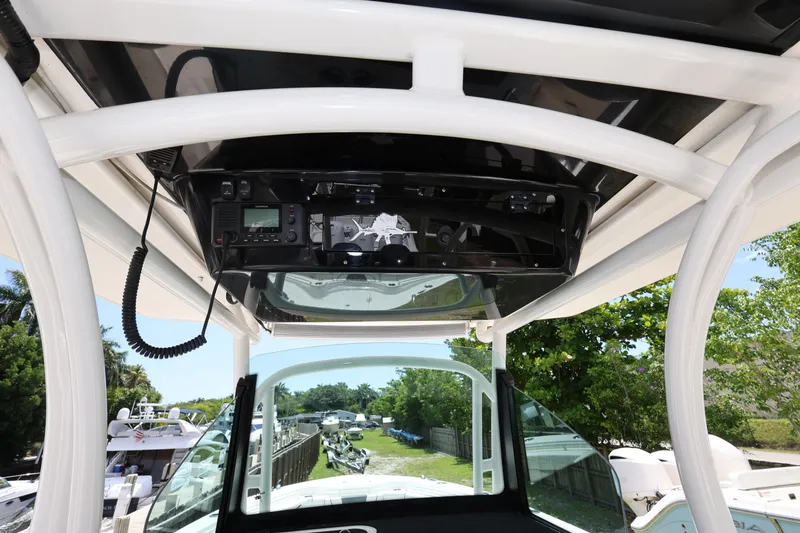 Slide: The Image of 2017 Wellcraft Scarab 302 Fisherman boat console with electronics and overhead view. - 17