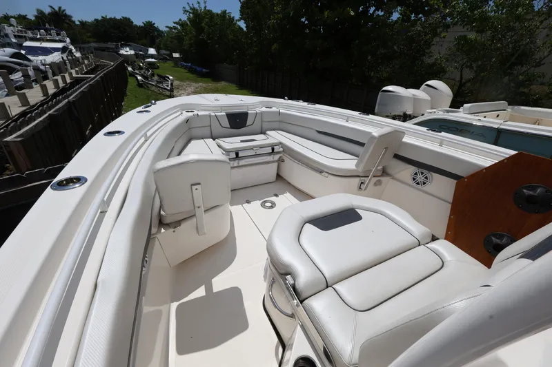 Slide: The Image of 2017 Wellcraft Scarab 302 Fisherman boat interior with white seating and spacious deck. - 18